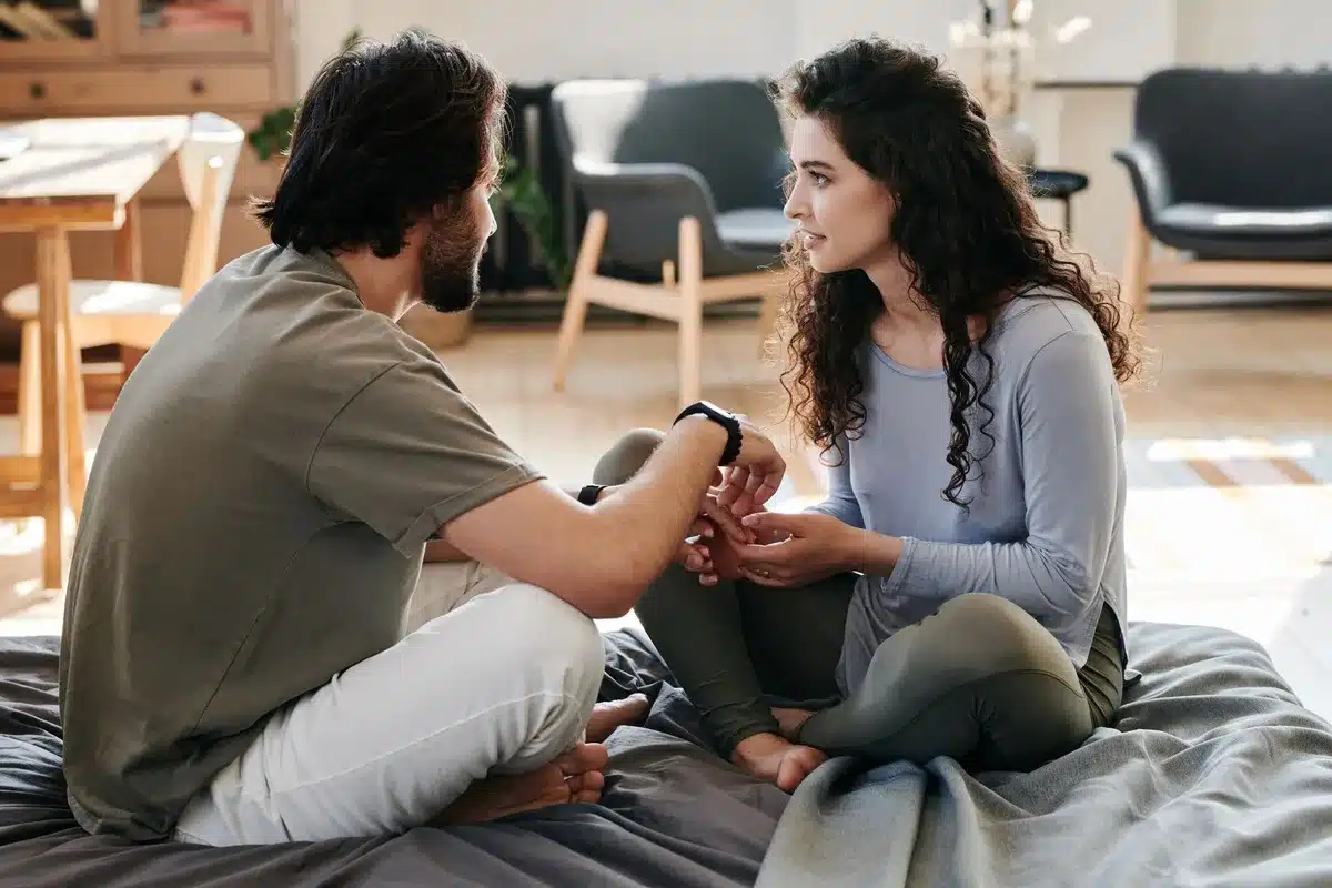 Two people having a serious conversation about relationship boundaries and trust.
