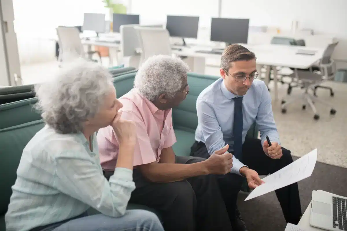 Financial advisor reviewing investment strategy and portfolio allocation with client