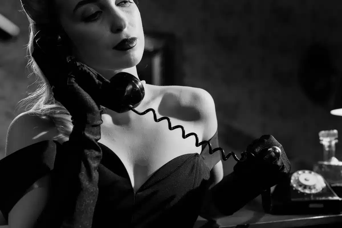 A classic film scene or noir-style imagery evoking the 'dangerous woman' trope.