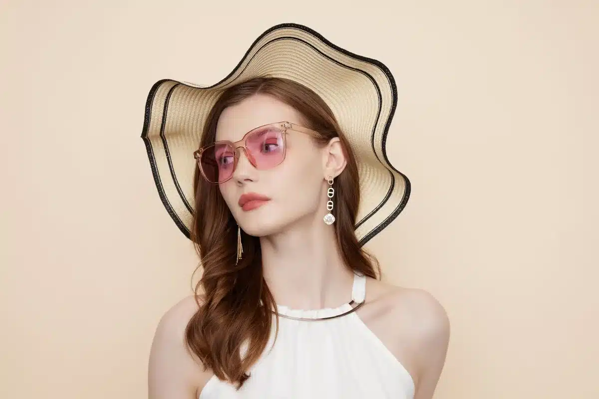 Close-up of a person's face with sunglasses frames highlighting facial features and symmetry