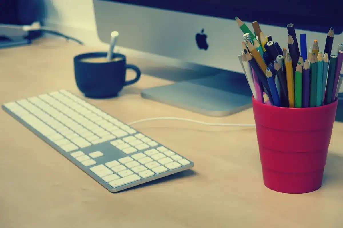 Cold mug beside papers and a laptop illustrating an abandoned ritual