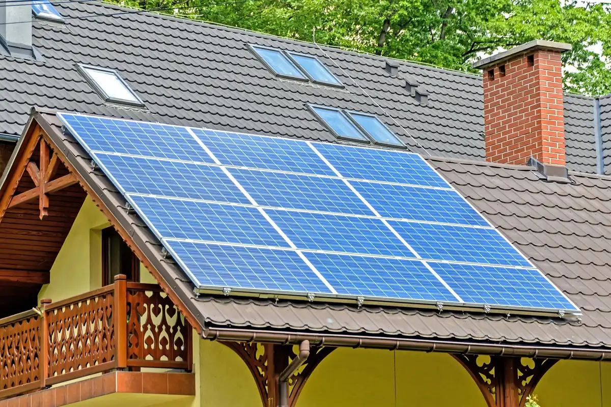 Hands arranging renewable energy components and financial documents symbolizing the $10 trillion green economy
