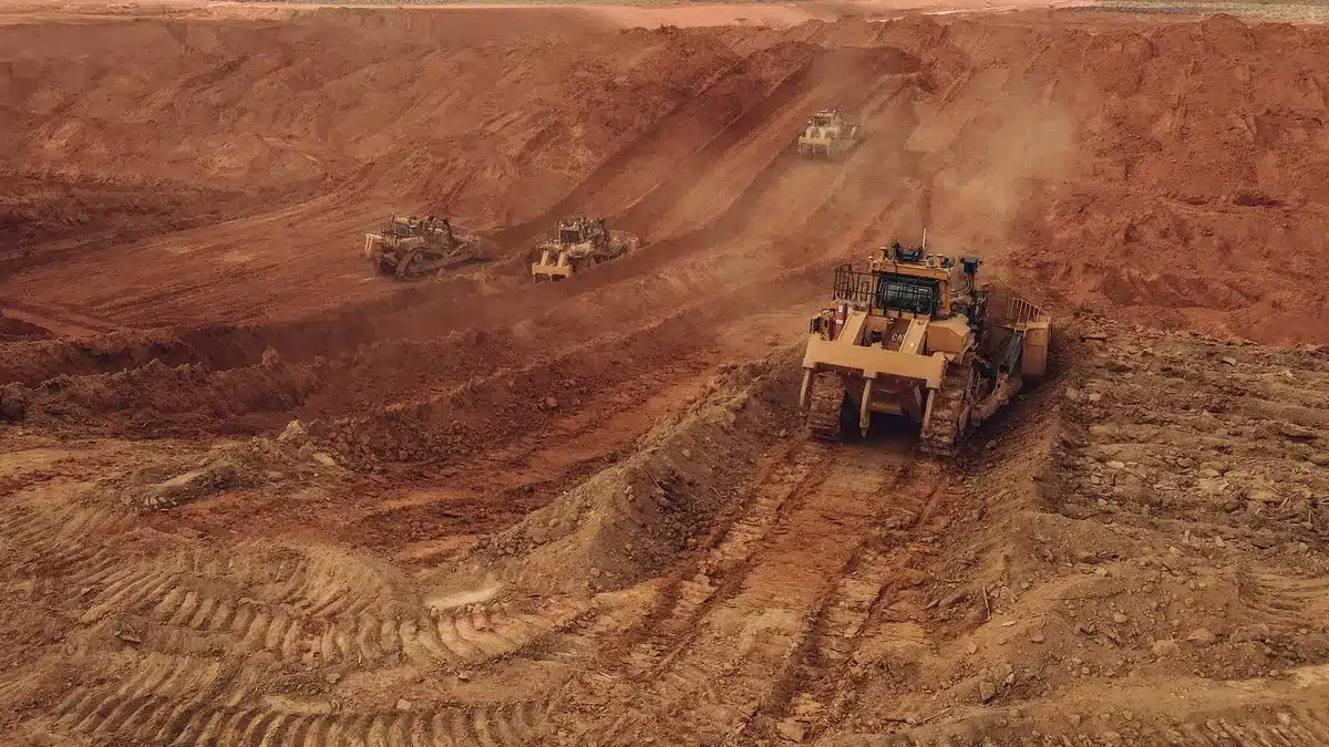 Bulldozer pushing gravel at a remote placer mining site