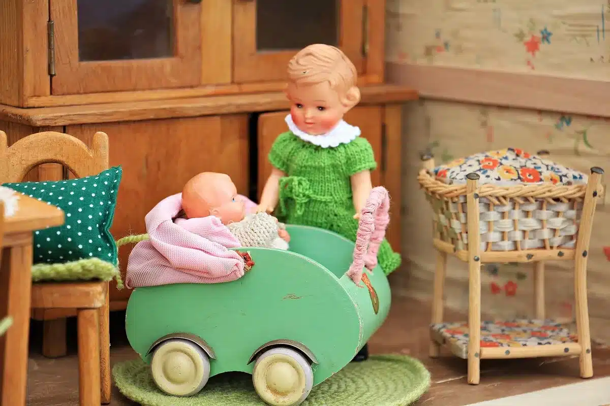 Two hands holding separate house keys above a table with paperwork and a toy, suggesting separation