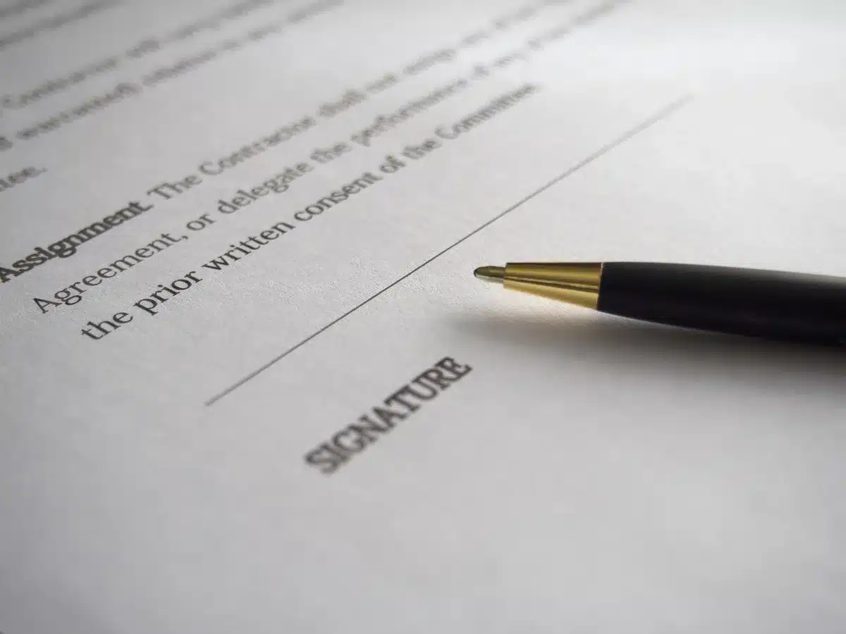 Anonymous person holding work authorization documents and a Social Security card