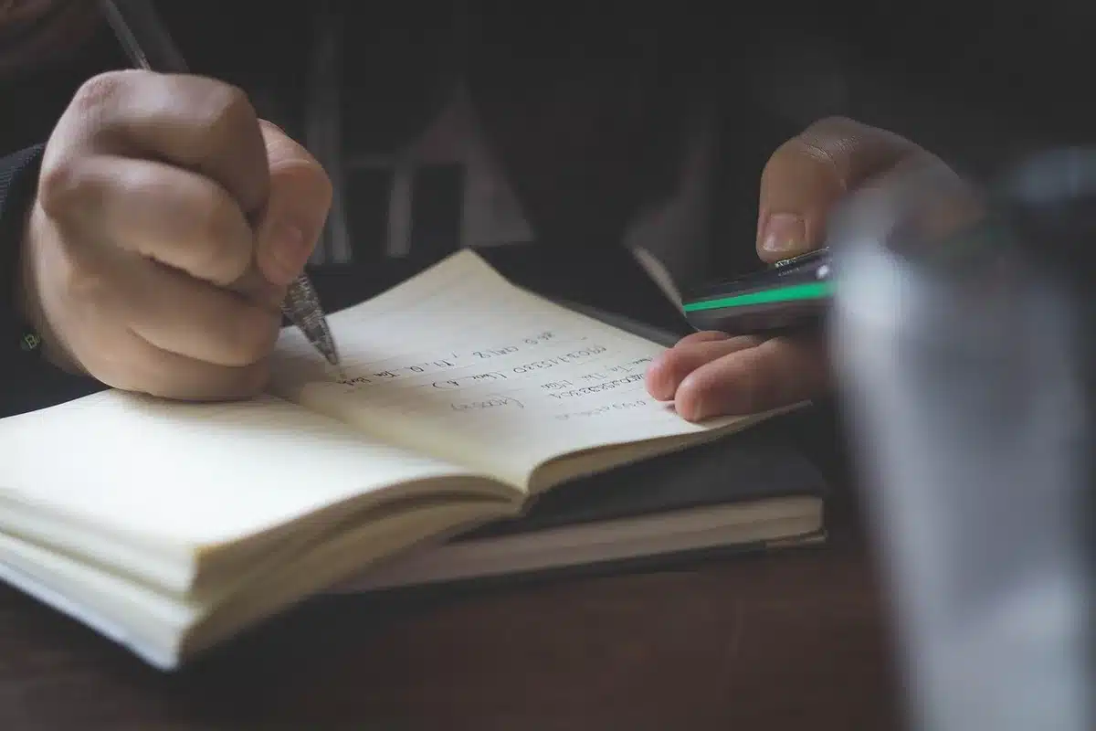 Therapist's notes and a pen on a desk about coping and resilience