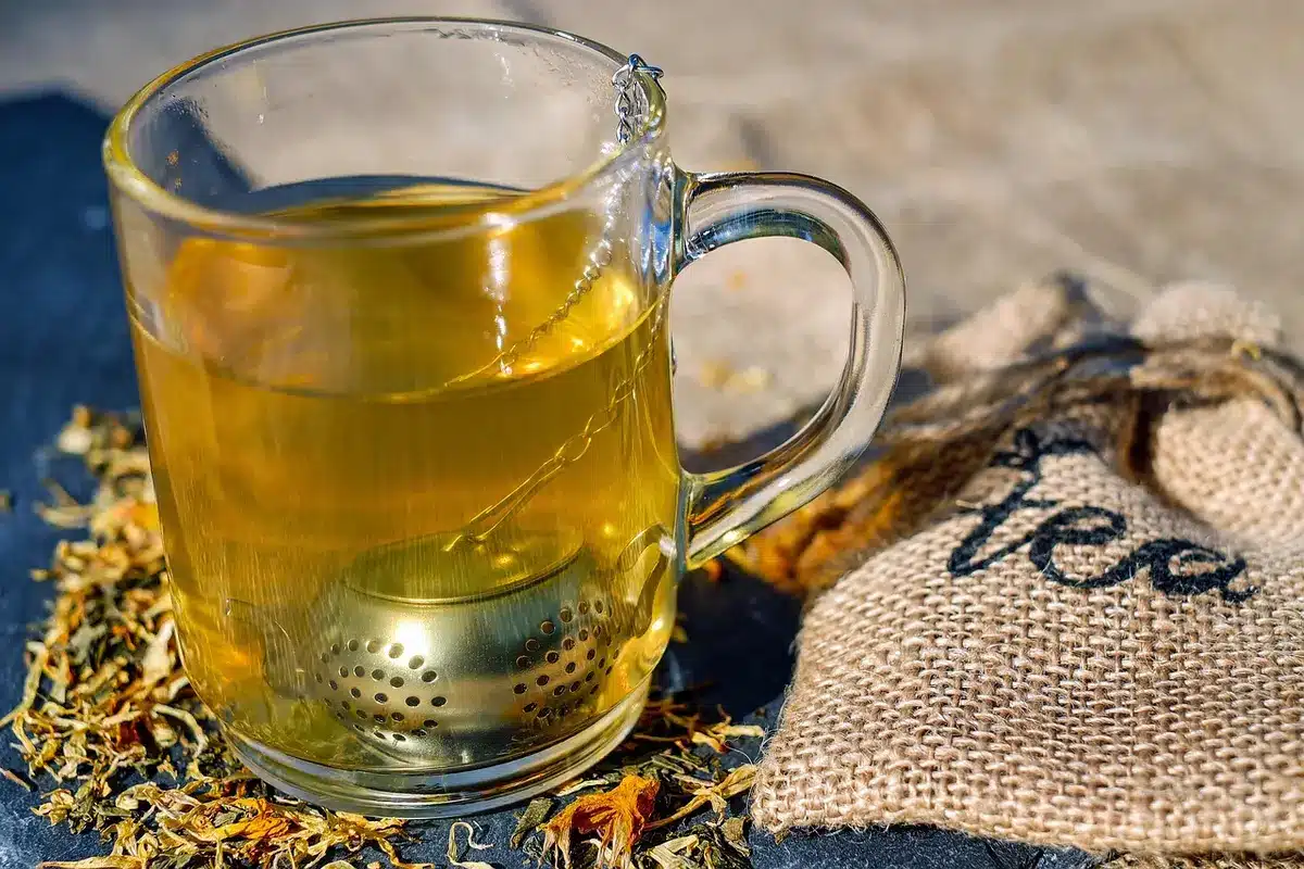 Cup of tea and comfortable clothes on a sofa signaling a simple transition ritual